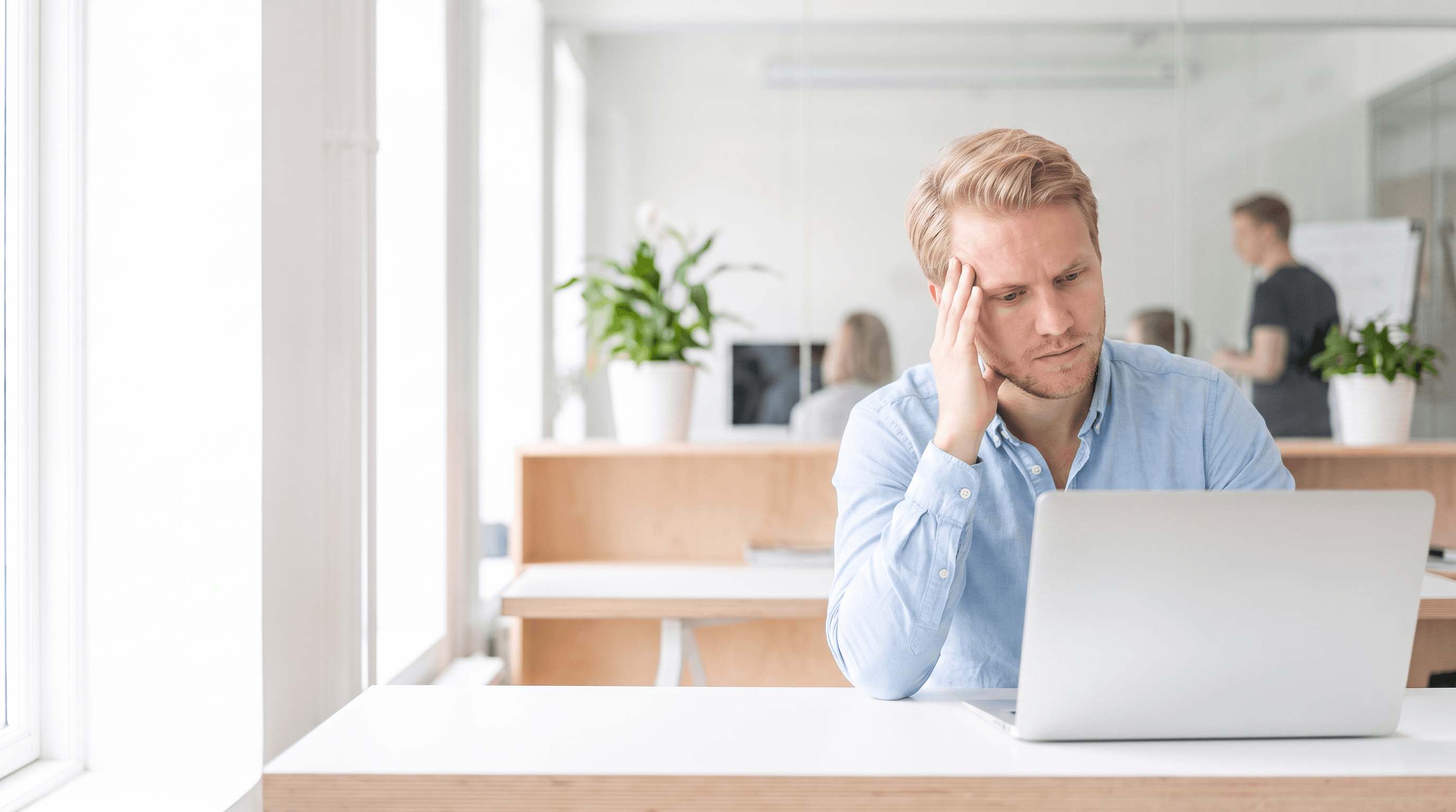 A consultant at work at their desk
